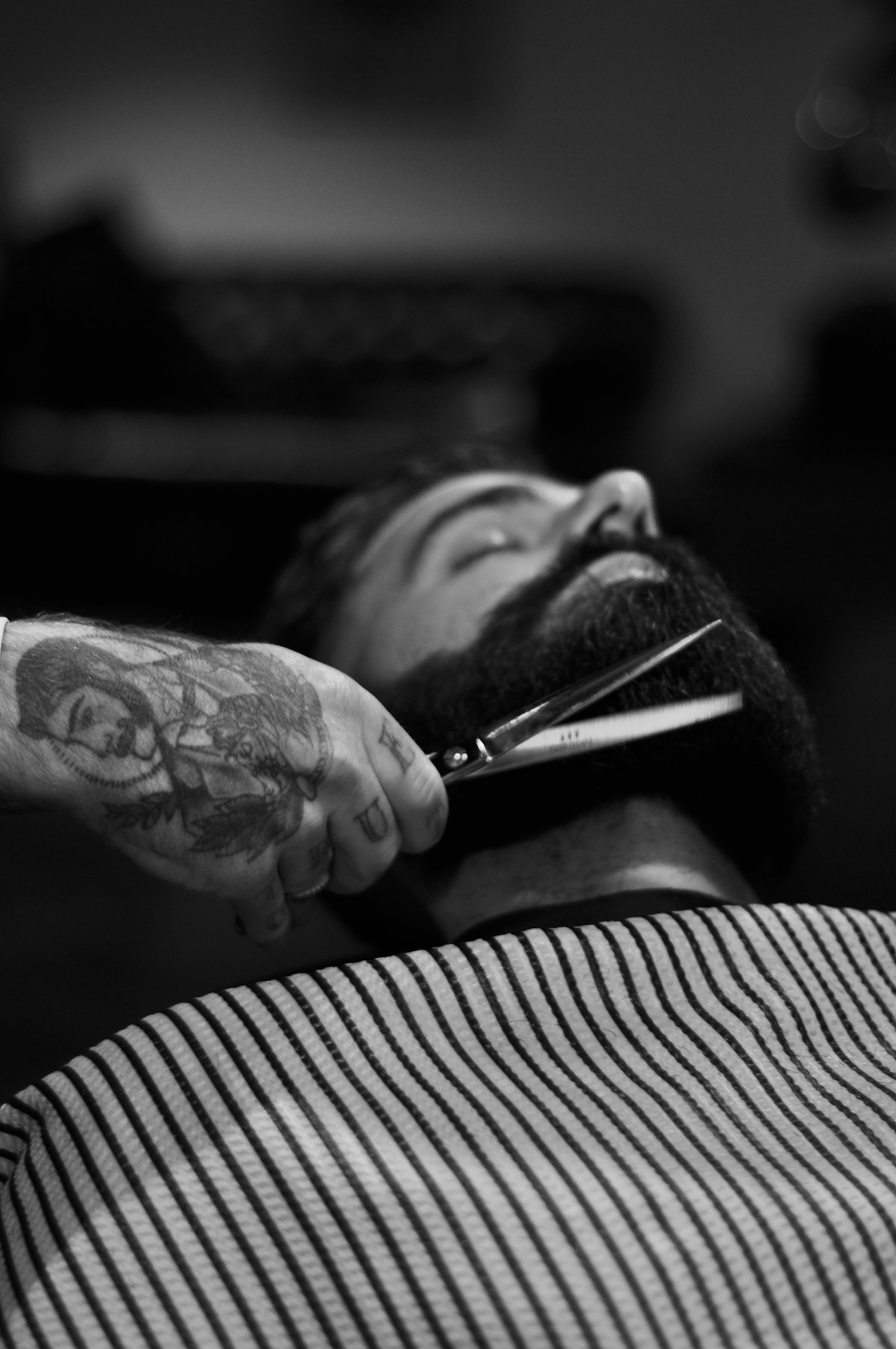 Scissor work over a beard, black and white